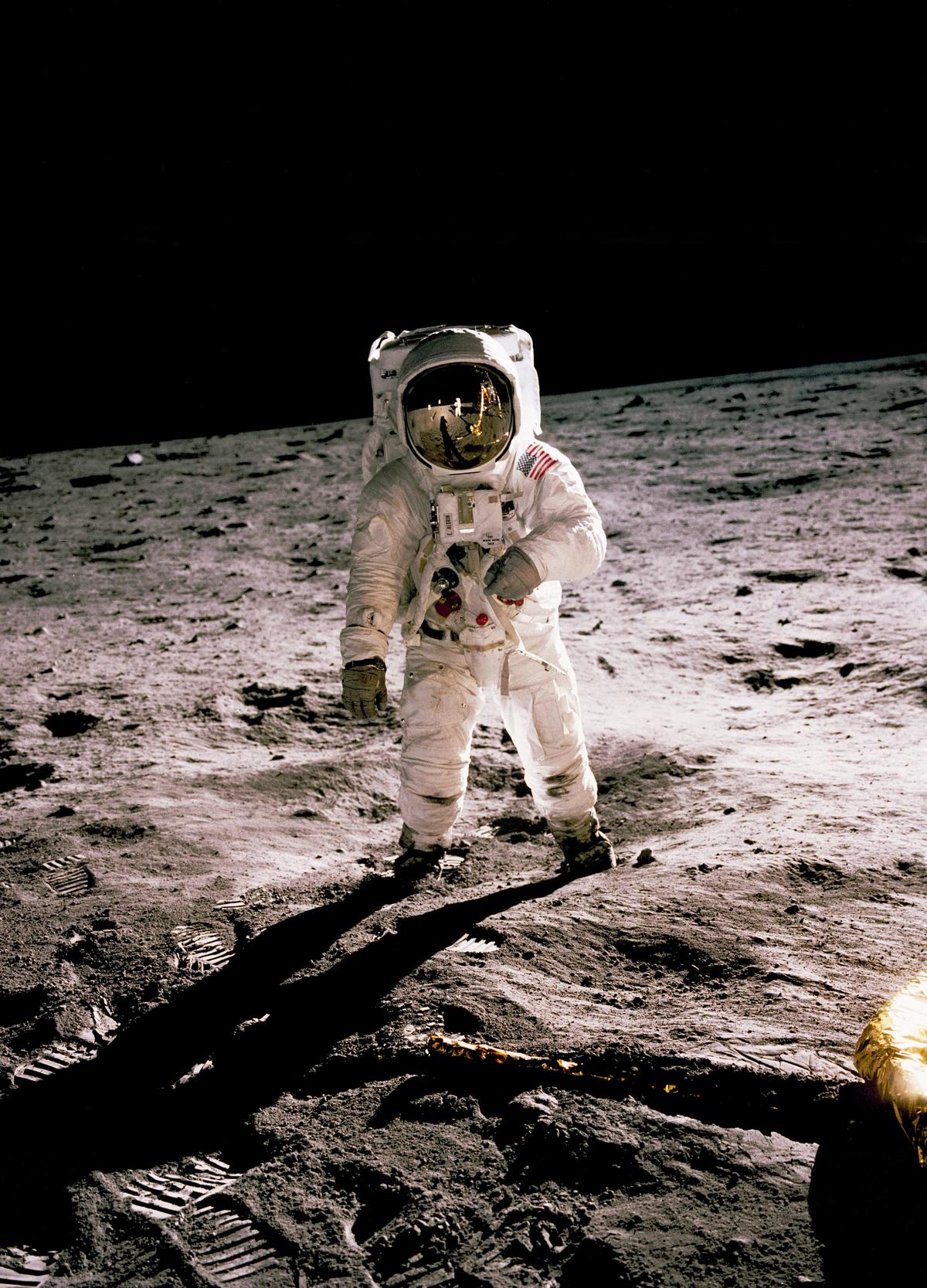 Image of astronaut walking on the moon, showcasing the achievements and discoveries of the Apollo missions.