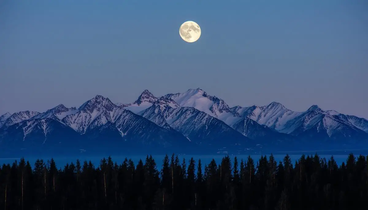 Harvest Moon rising over mountains near Anchorage, Alaska