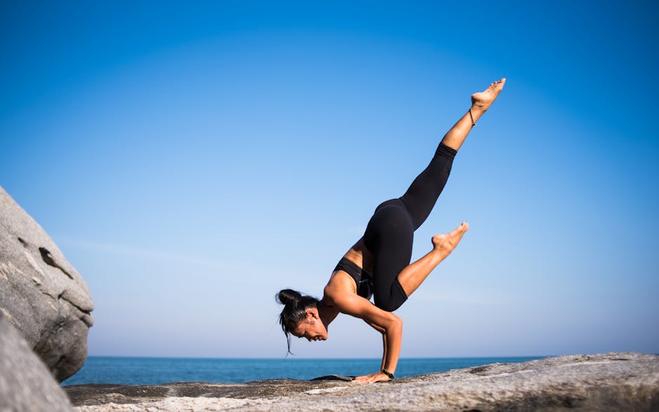 A person practicing yoga outdoors, symbolizing health and well-being