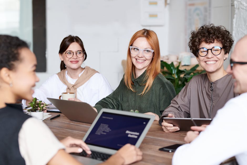 A confident Cancer individual leading a diverse team meeting in a modern office