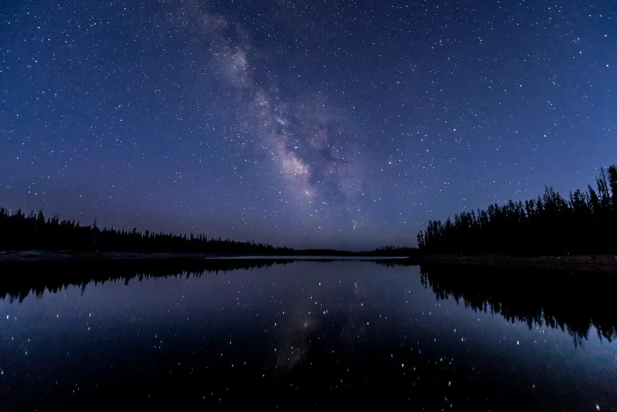 A clear night sky showing several prominent constellations formed by patterns of stars.