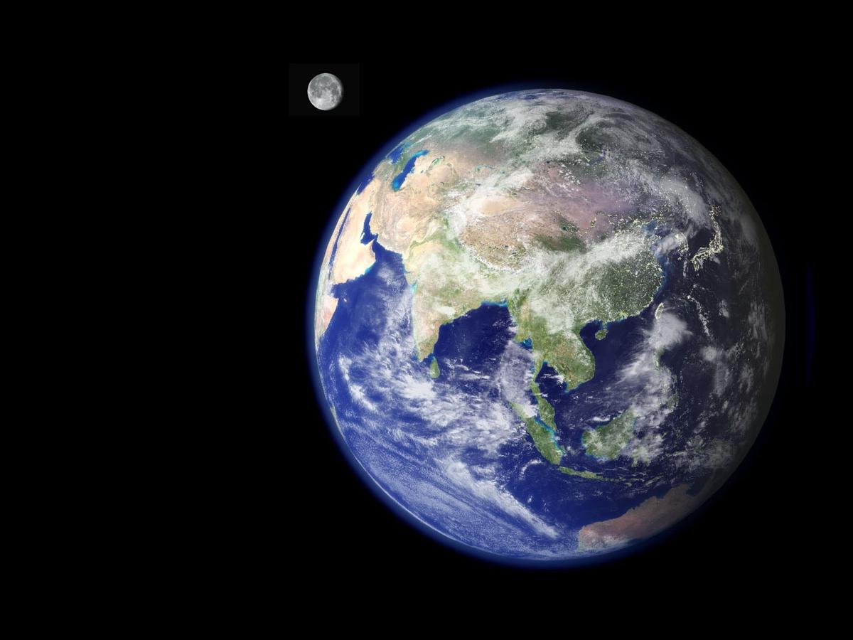 An illustration of the Earth and its large moon, showcasing their unique relationship within the solar system. The Earth is shown with its blue oceans and green continents, while the Moon is depicted in its cratered, grayish appearance. The sizes of the Earth and Moon are shown in proper proportion to each other.