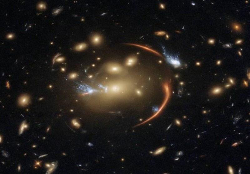 A massive galaxy cluster bending light from a distant galaxy, creating multiple arc-like images around it