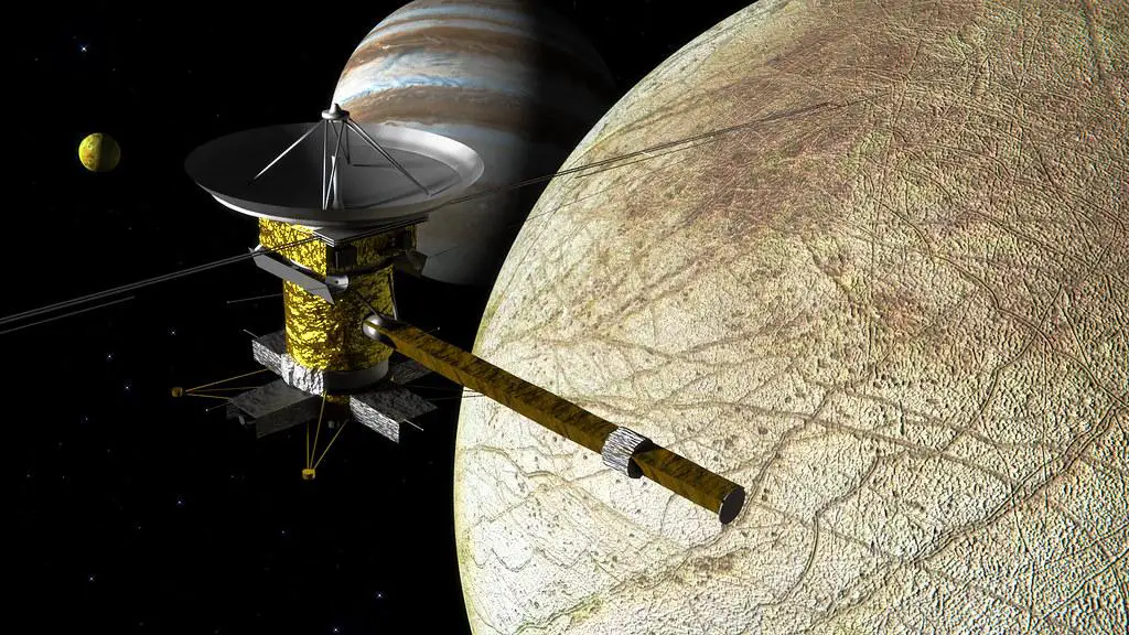 Europa Clipper spacecraft performing a close flyby of Jupiter's moon Europa, with instruments actively scanning the icy surface