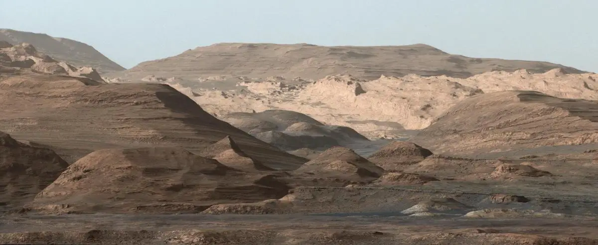 Gale Crater on Mars with Mount Sharp (Aeolis Mons) rising from its center, showing layered geological formations