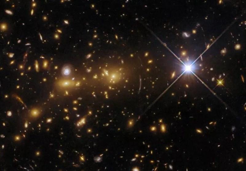 A massive galaxy cluster bending light from distant galaxies, creating multiple distorted images around it