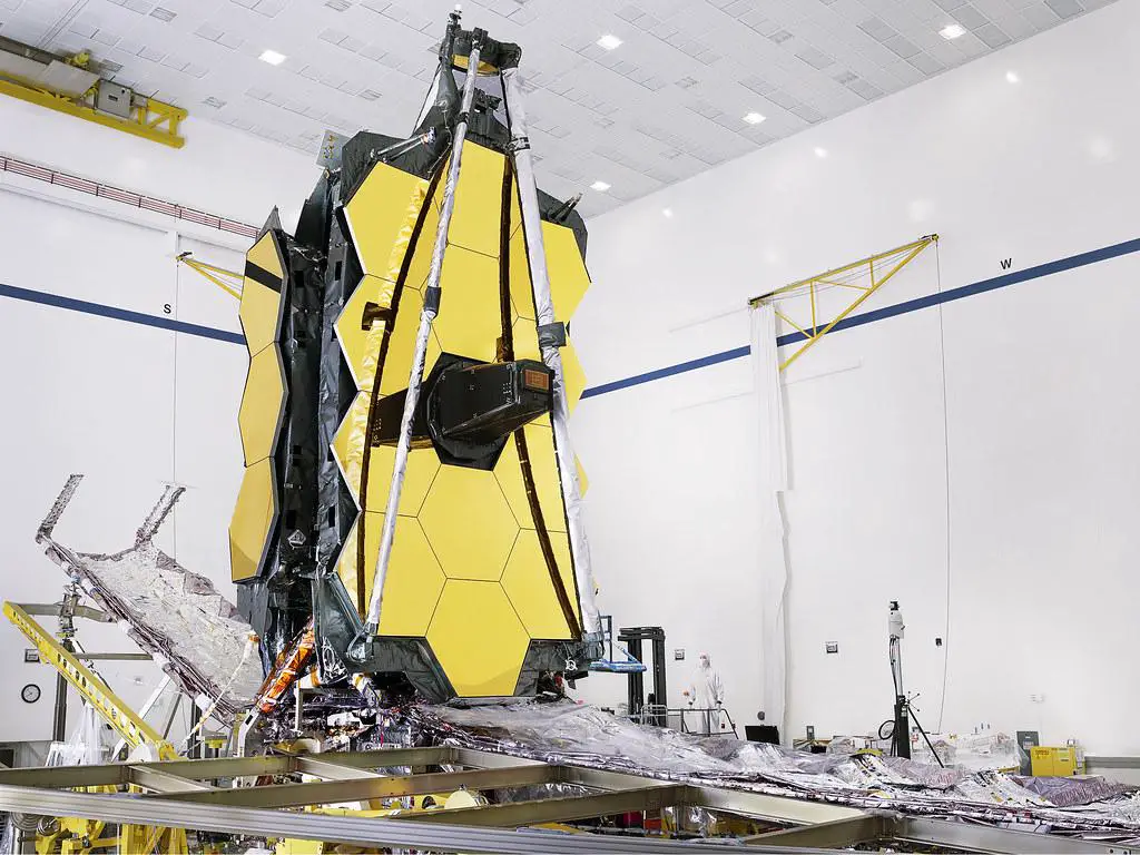 A detailed view of the James Webb Space Telescope's key technological components, including its segmented mirror, sunshield, and scientific instruments