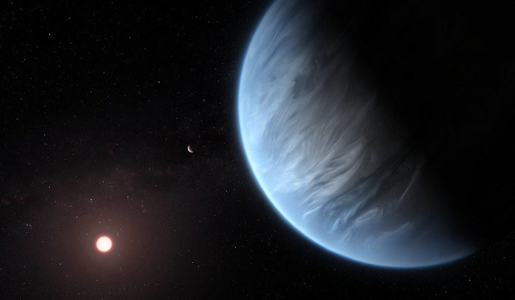 Artist's concept of the exoplanet K2-18b with potential biosignatures in its atmosphere