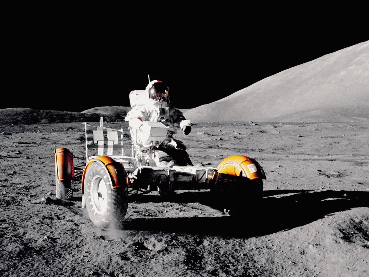 An image depicting astronauts exploring the lunar south pole with advanced technology and rovers.