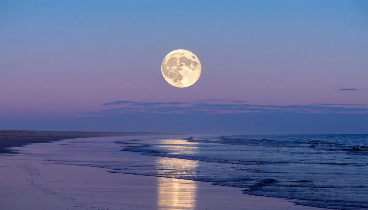 Full moon rising over a beach with visible tidal patterns