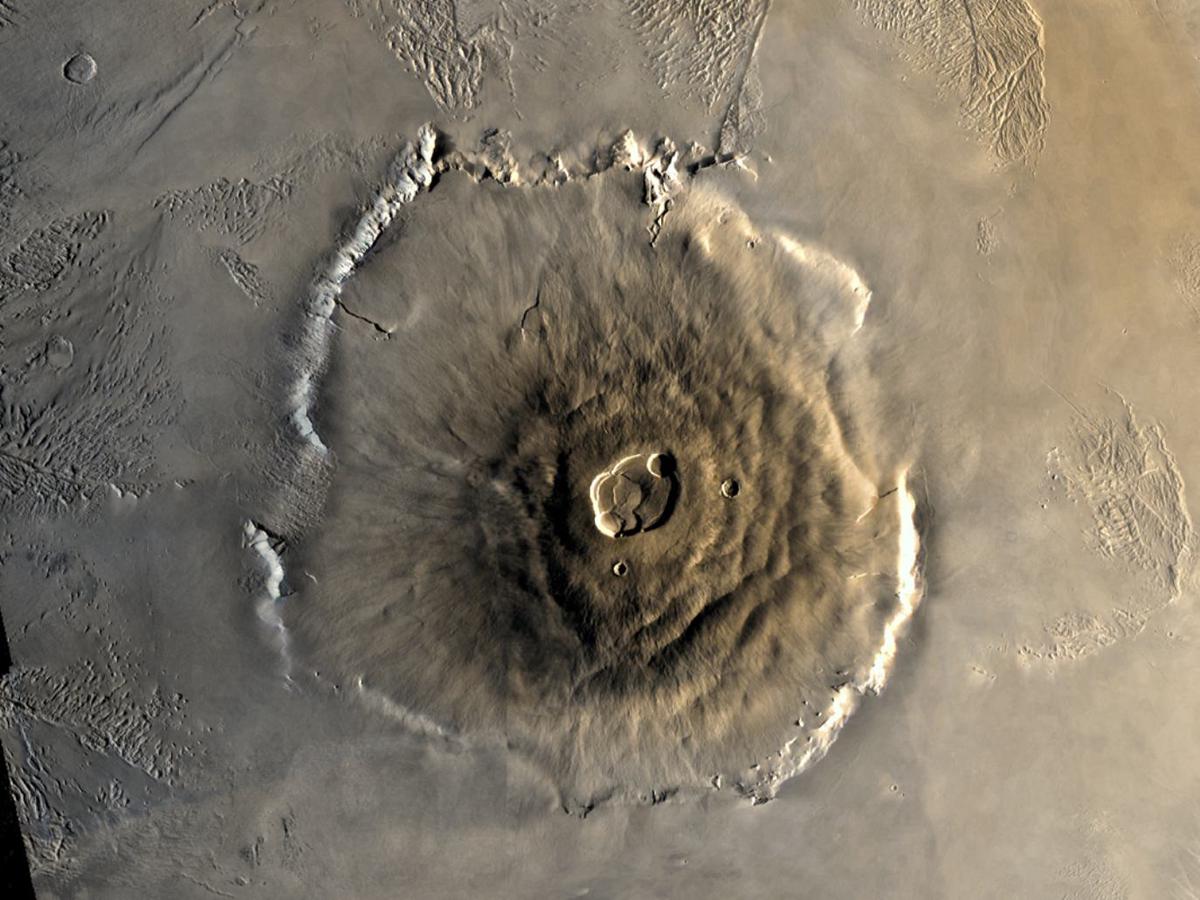 Olympus Mons, the largest known volcano in the solar system, towering above the Martian surface