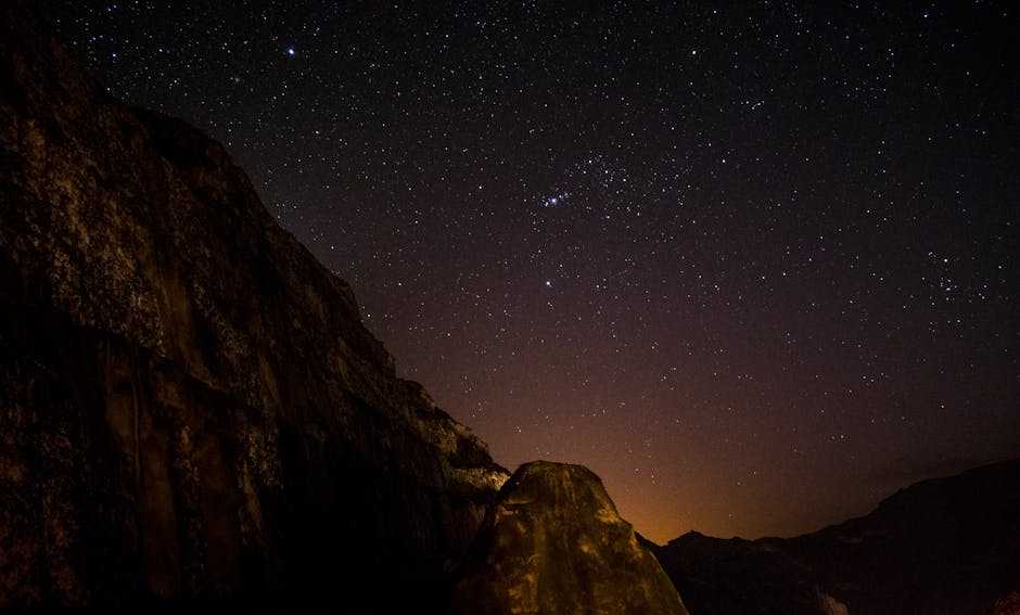 The Orion constellation prominently visible in a clear night sky, with its distinctive belt and bright stars