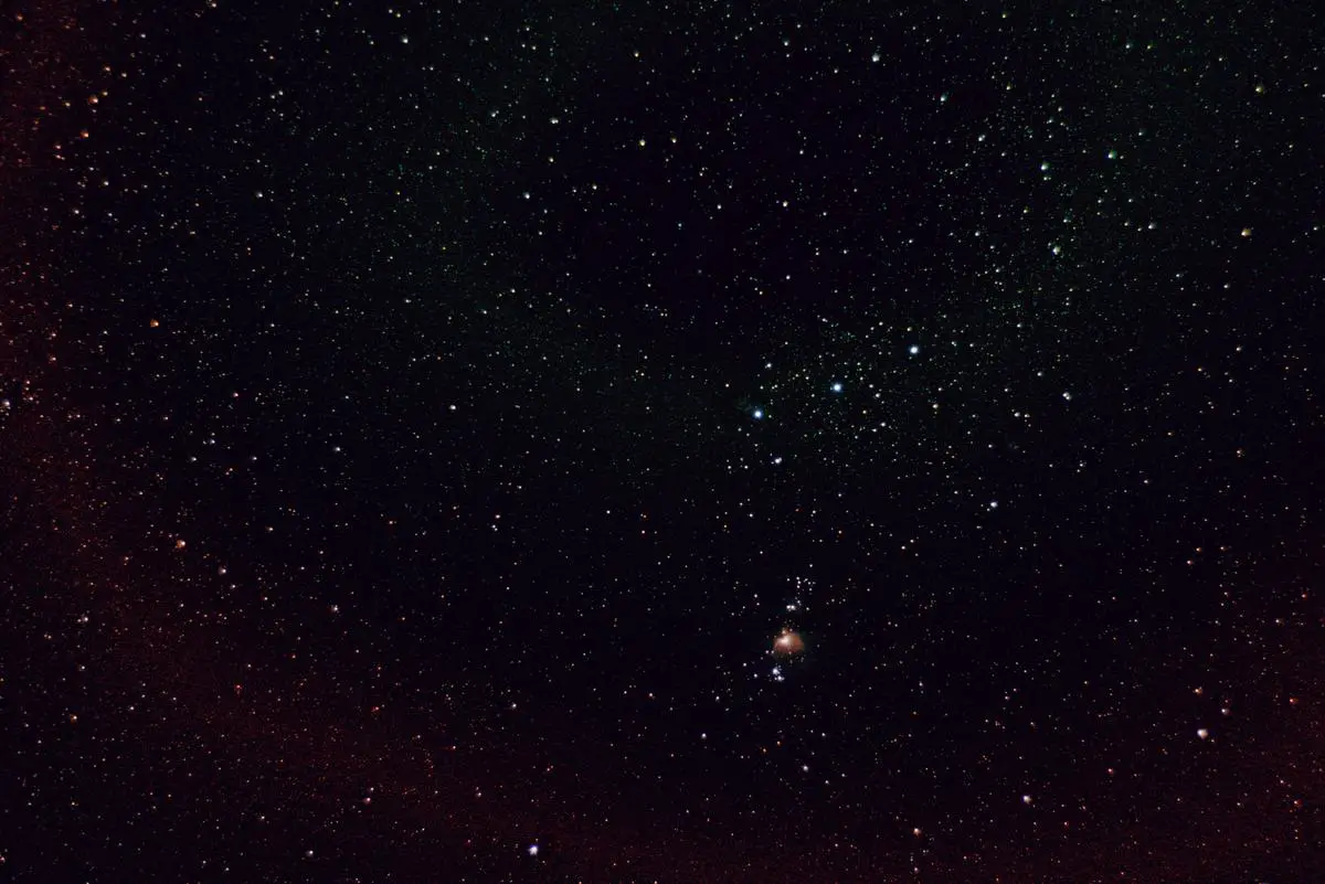 Orion's Belt constellation prominently visible in a clear night sky