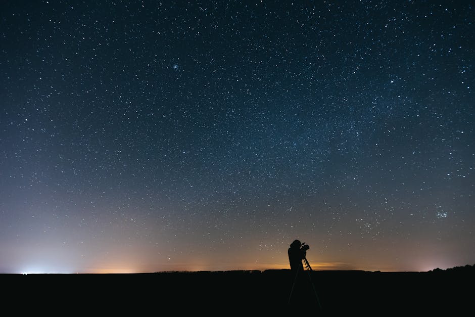 A person using a telescope to observe the night sky