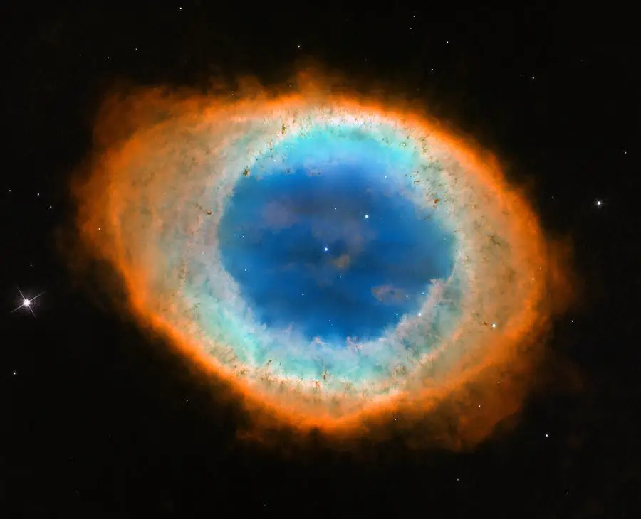 The Ring Nebula as seen through a telescope, showing its distinctive smoke ring appearance