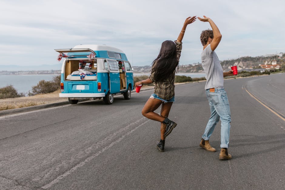 A couple on a spontaneous road trip, representing Sagittarius's love for freedom and adventure
