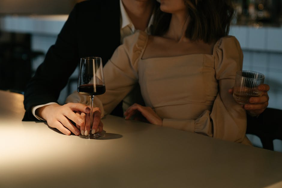 A couple in deep conversation at a dimly lit, intimate speakeasy
