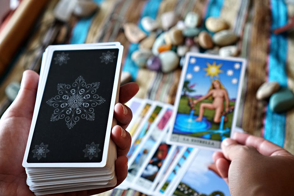 A person in deep contemplation while holding a tarot card, representing personal growth in love