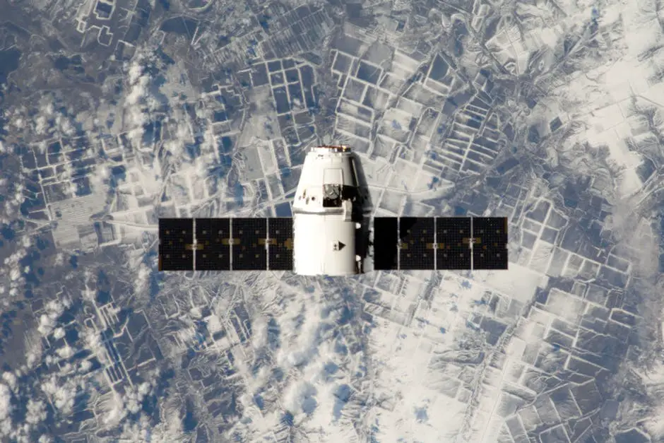 SpaceX Dragon capsule Endeavour in orbit, with Earth visible in the background