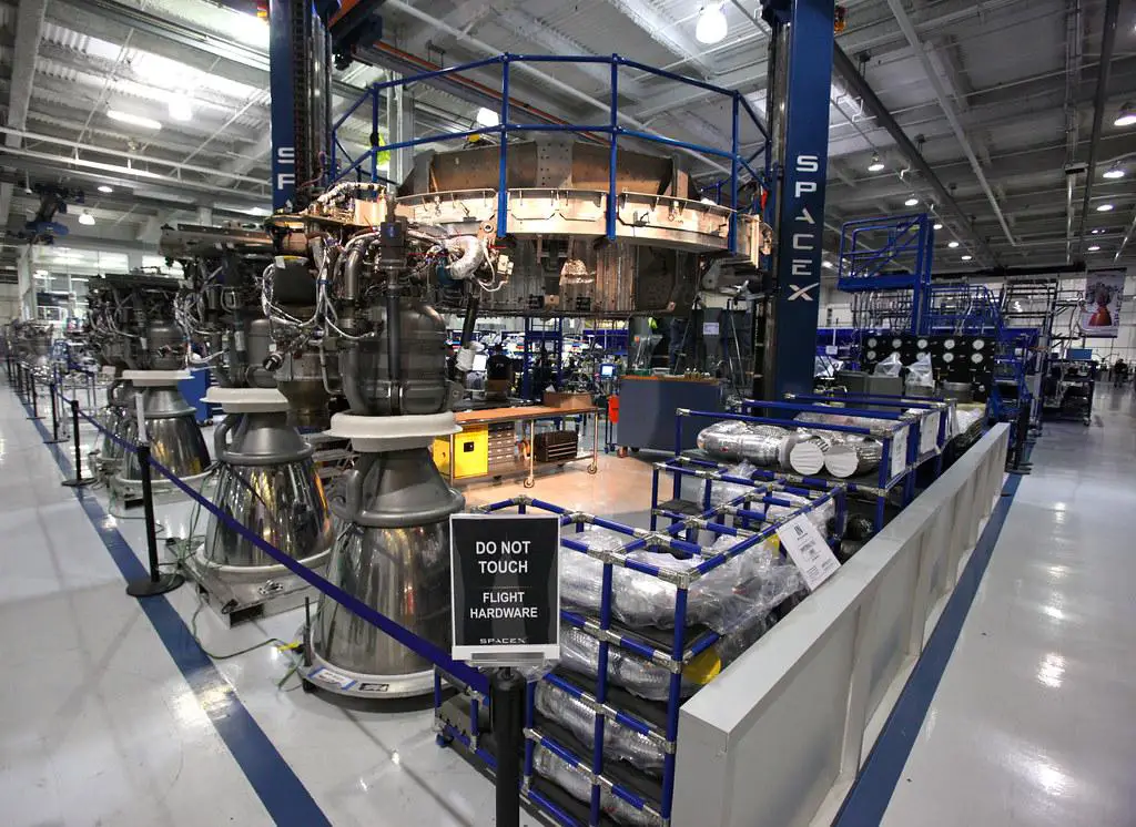 SpaceX Starship being assembled in a vertical integration facility, showcasing the company's in-house manufacturing capabilities