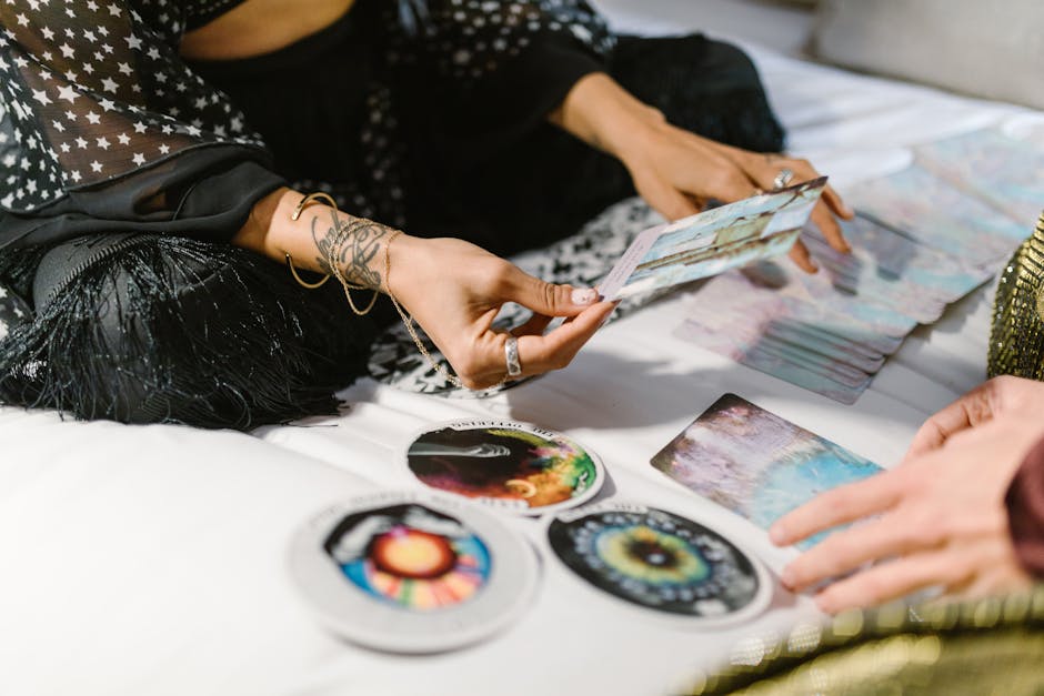 A tarot spread laid out on a table, showcasing cards for relationship insights