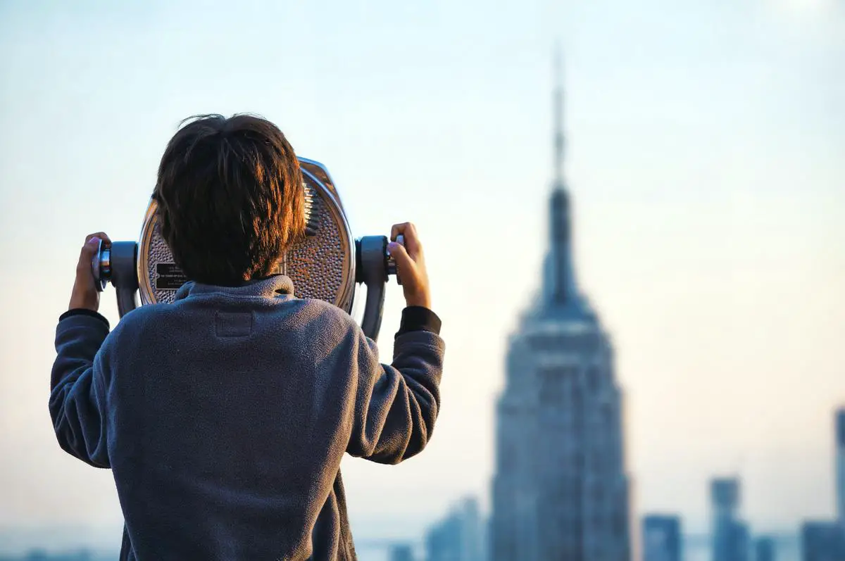 Image of a telescope being set up by a person